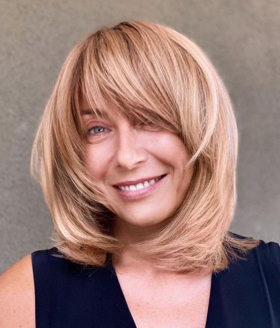 Chic bob with fringe, modern haircut, flattering style