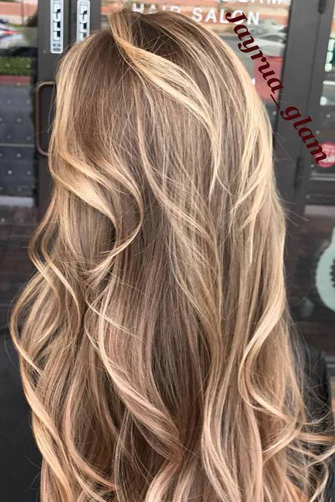 Luxurious blonde hair, long locks, spring hair trends