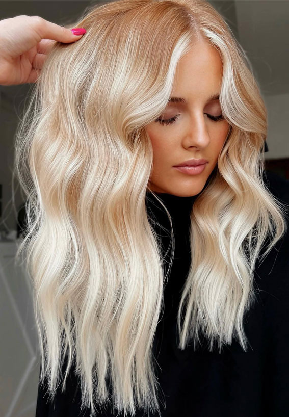 Medium-length blonde hair with soft waves