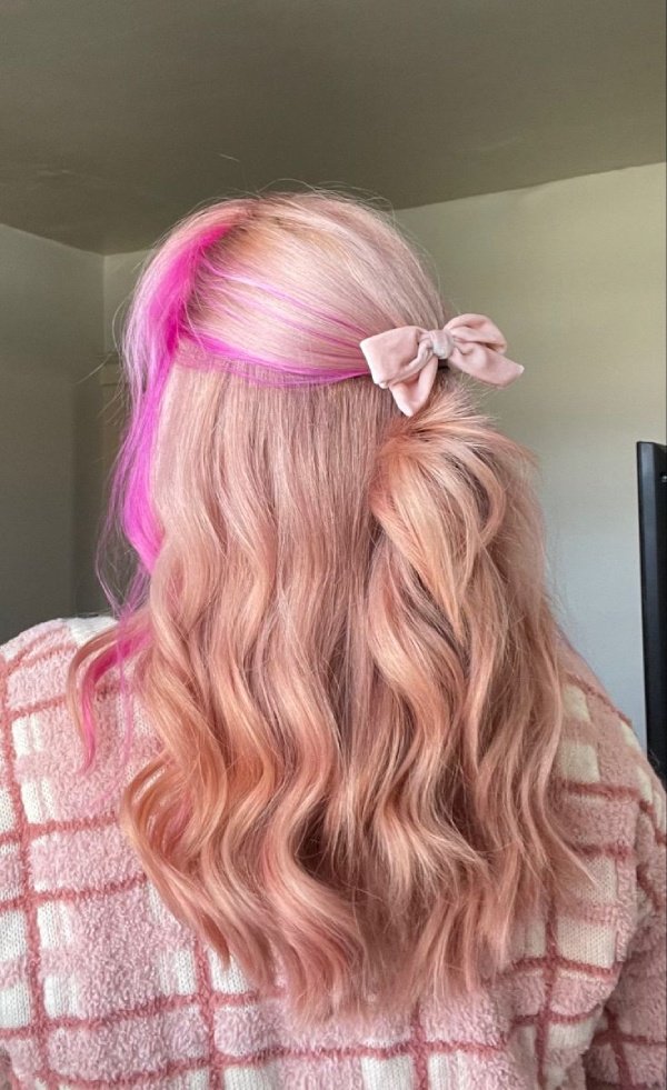 Pastel pink accents in strawberry blonde hair