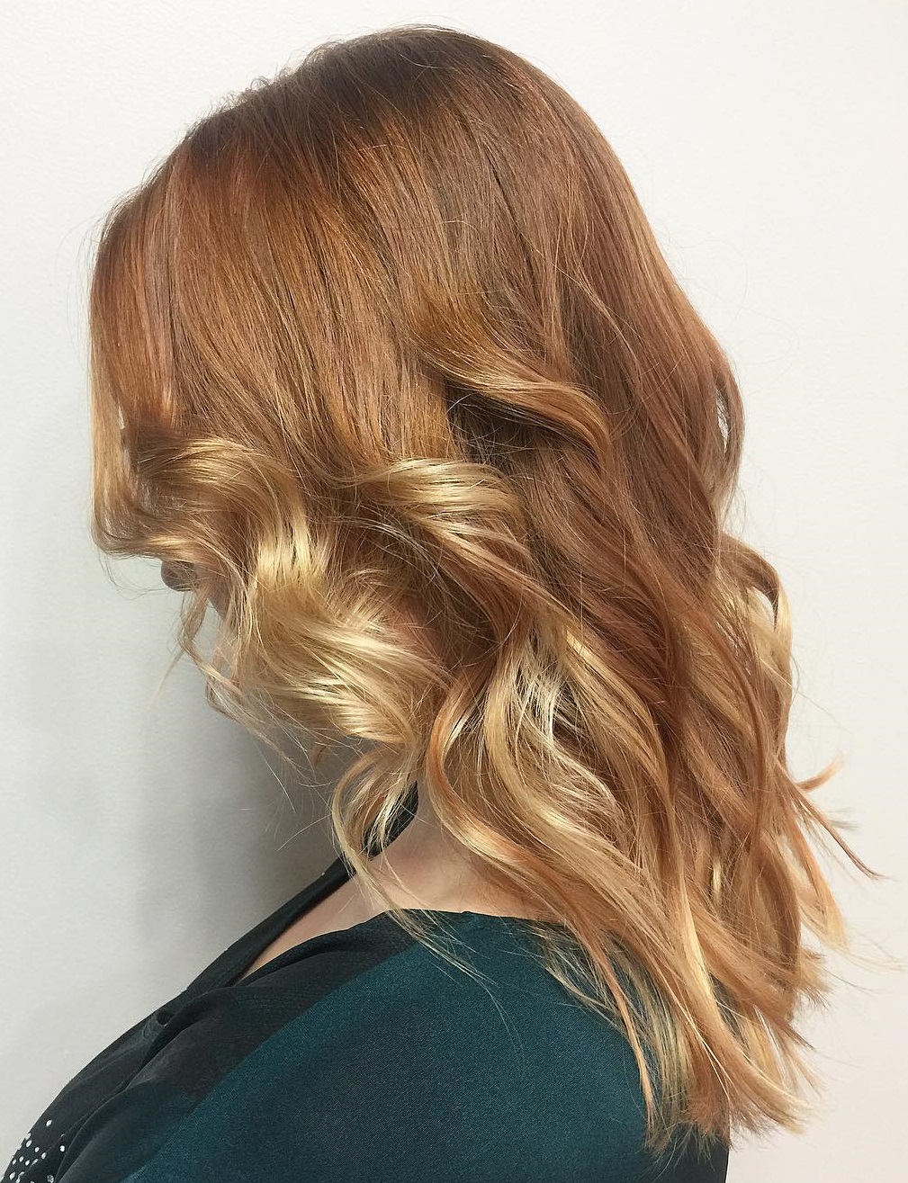 Copper and blonde wavy hair with dimension