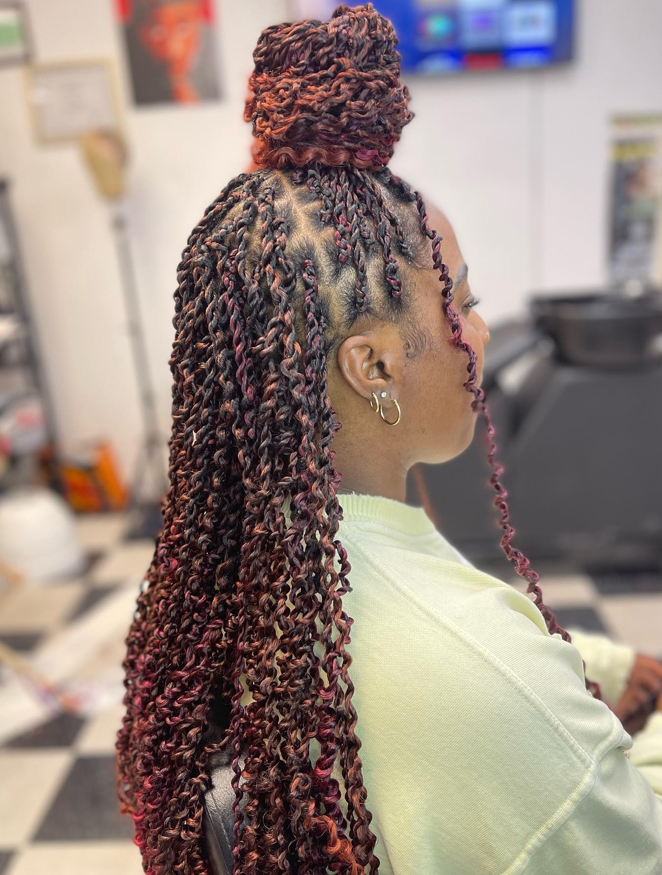 High bun with red twist braids