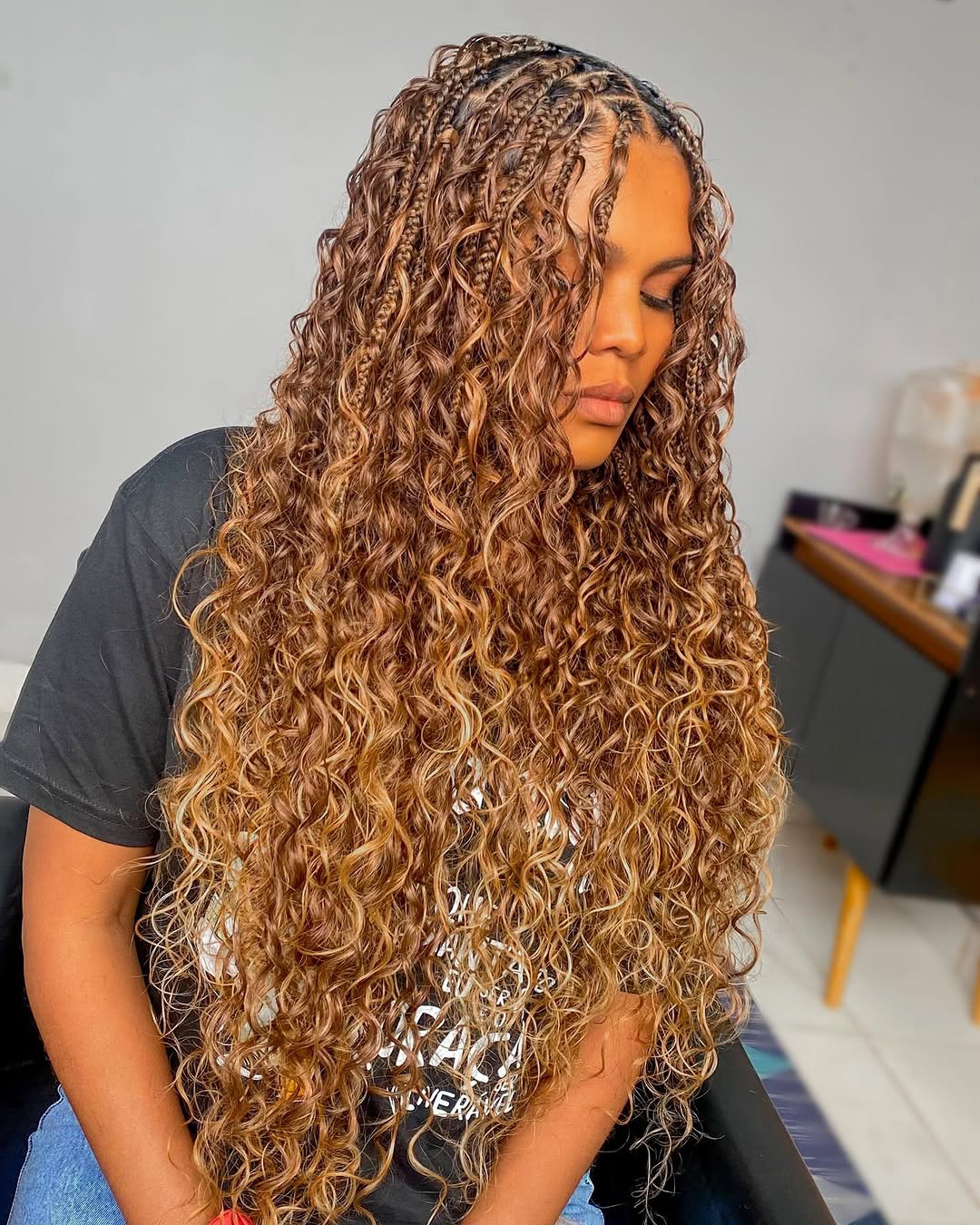 Long curly twist braids with highlights