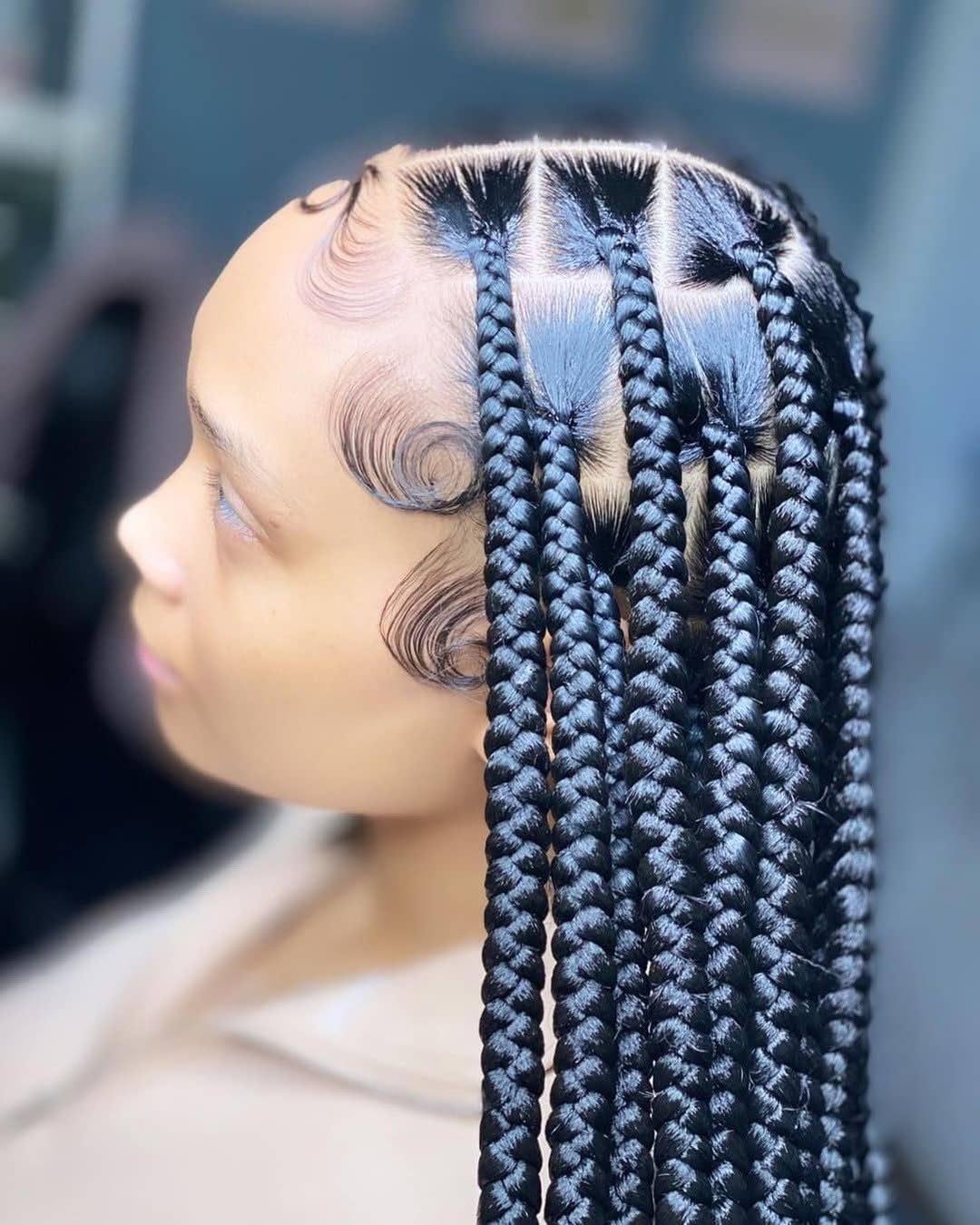 Sleek braids with sculpted edges