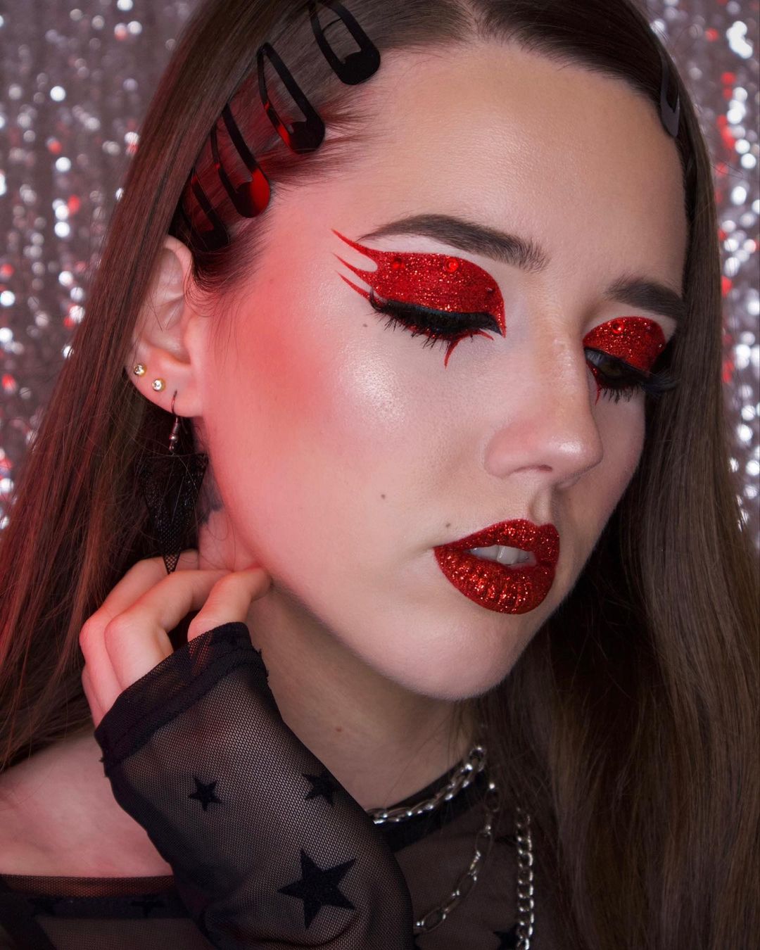 Red glitter eye makeup, bold statement