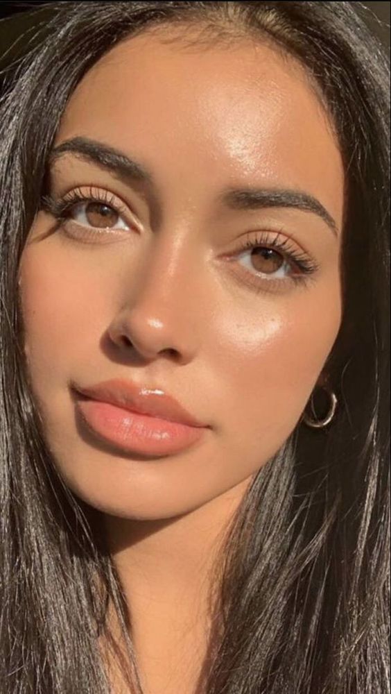 Natural glowy skin with minimal makeup and nude lips