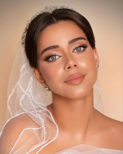 Golden bridal makeup with soft veil