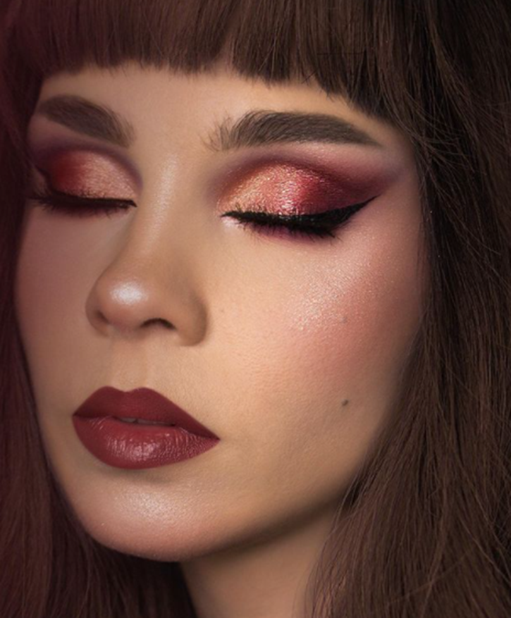 Metallic eyes with bold eyeliner and red lips