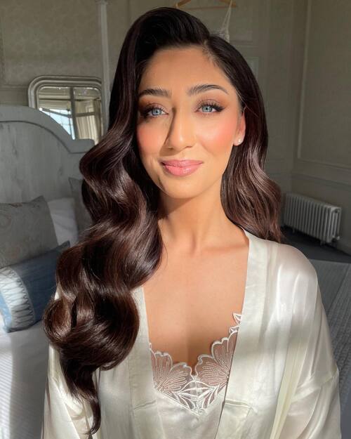 Glam wedding makeup with voluminous hair