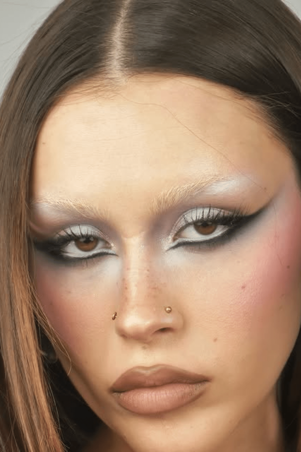 Bold avant-garde makeup with graphic liner