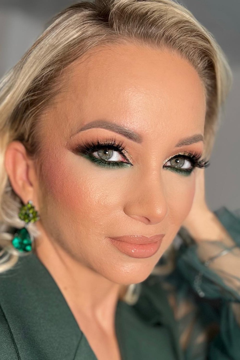 Sophisticated green eye makeup with nude lips