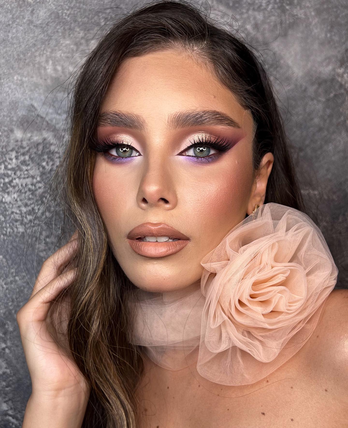 Vivid eye makeup with nude lips for weddings