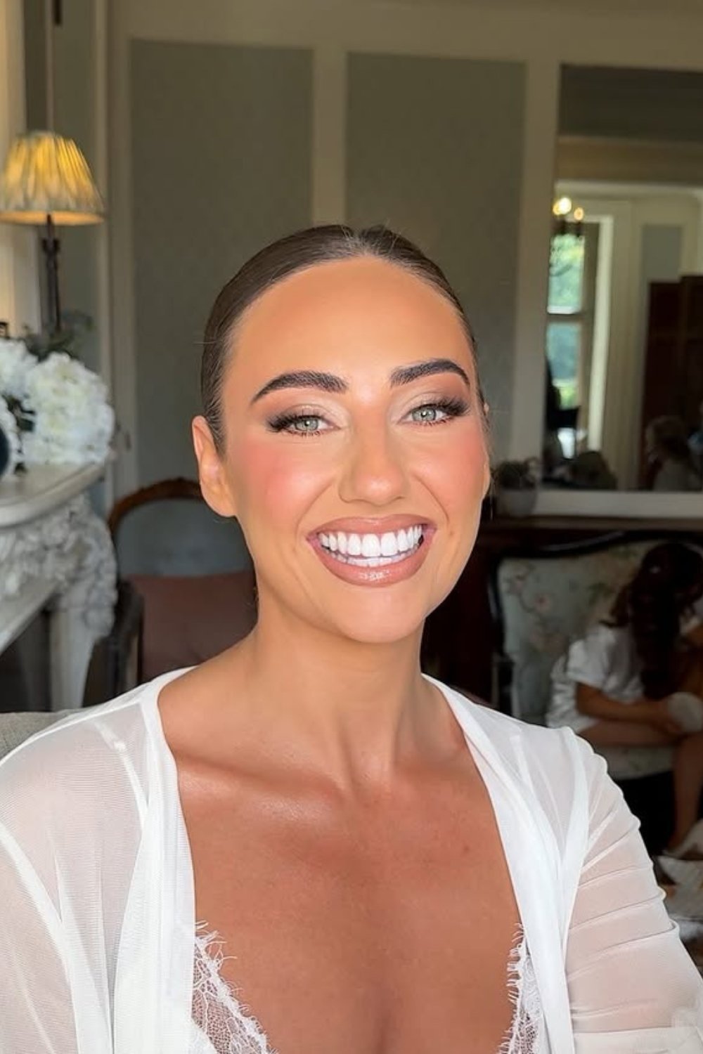 Radiant smile with polished sophisticated wedding makeup