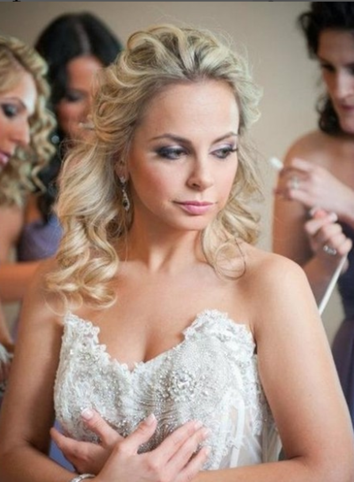 Elegant soft glam wedding makeup with curls