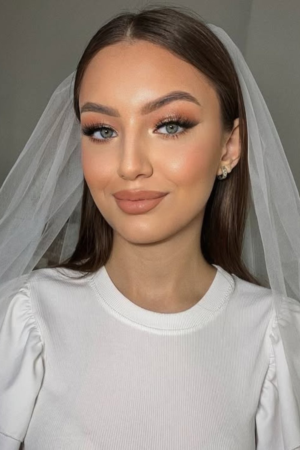 Classic nude wedding makeup with modern flair