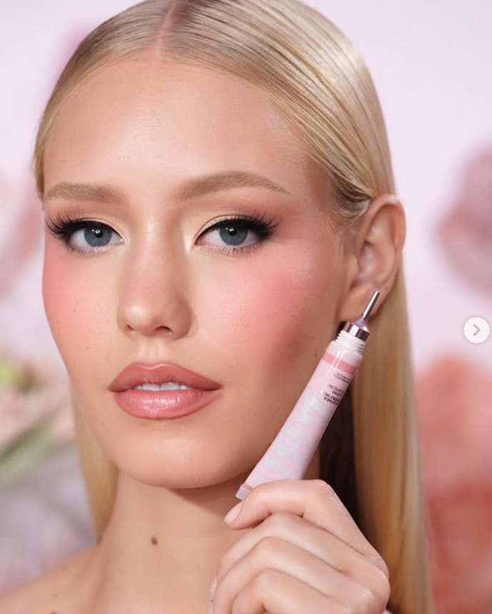 Classic pink makeup with matte finish and sleek hair