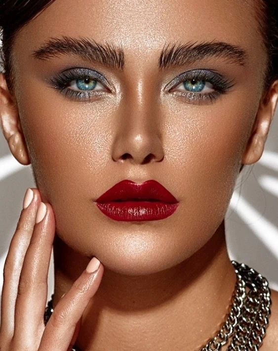 Bold red lipstick structured makeup