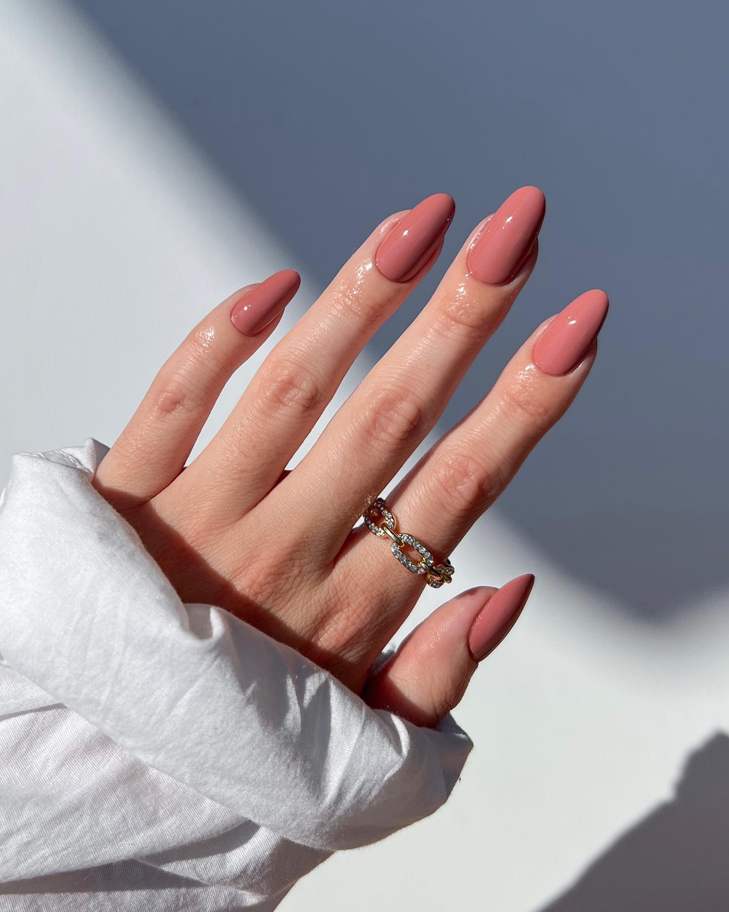 Nude almond nails with glossy finish