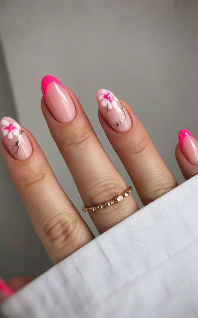 Hot pink nails with floral patterns