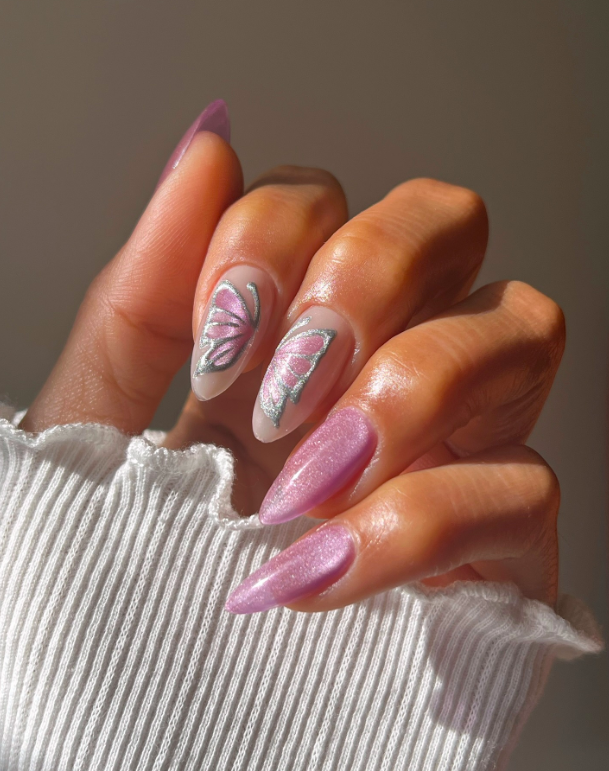 Butterfly design on pastel pink nails