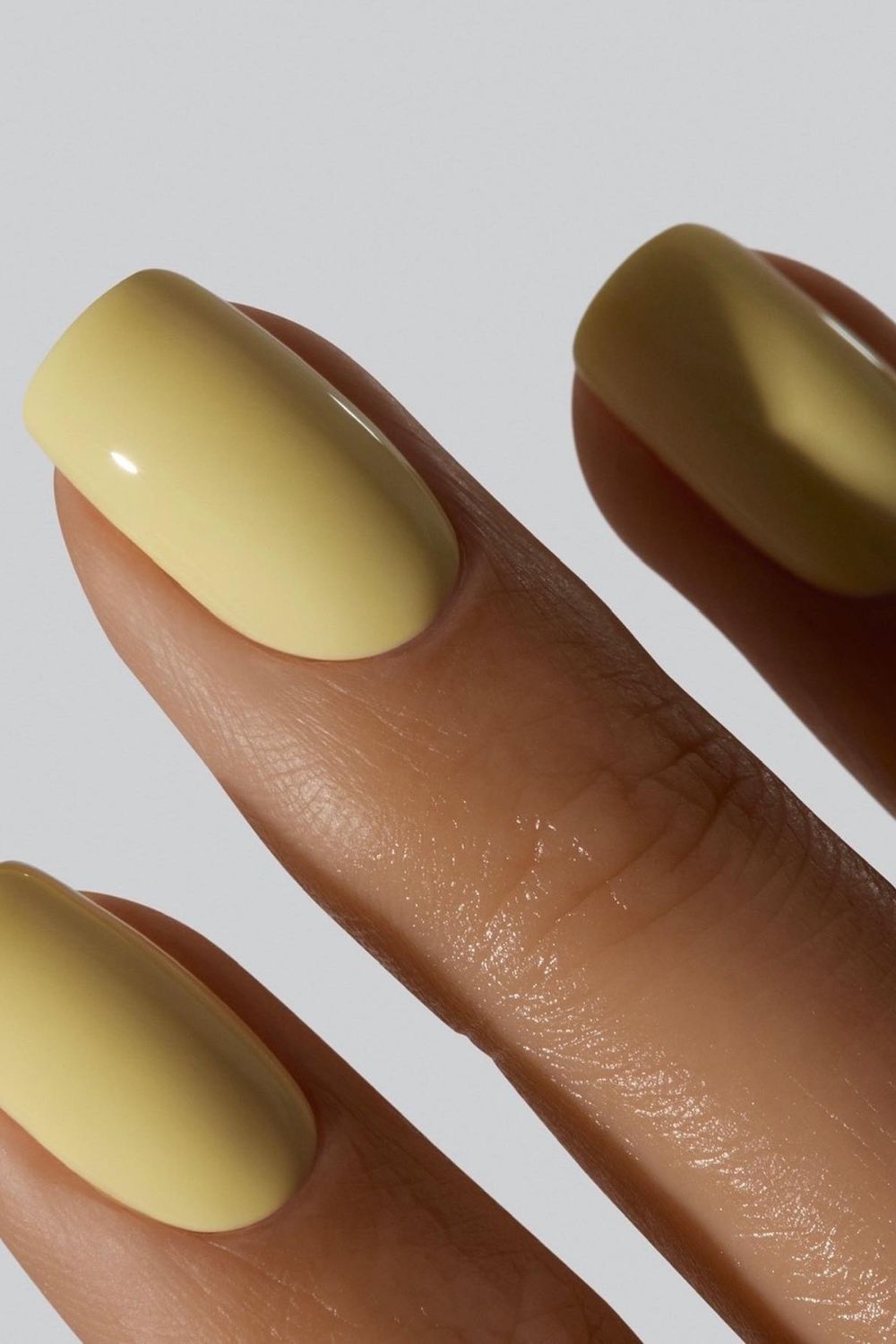 Glossy lemon yellow nails