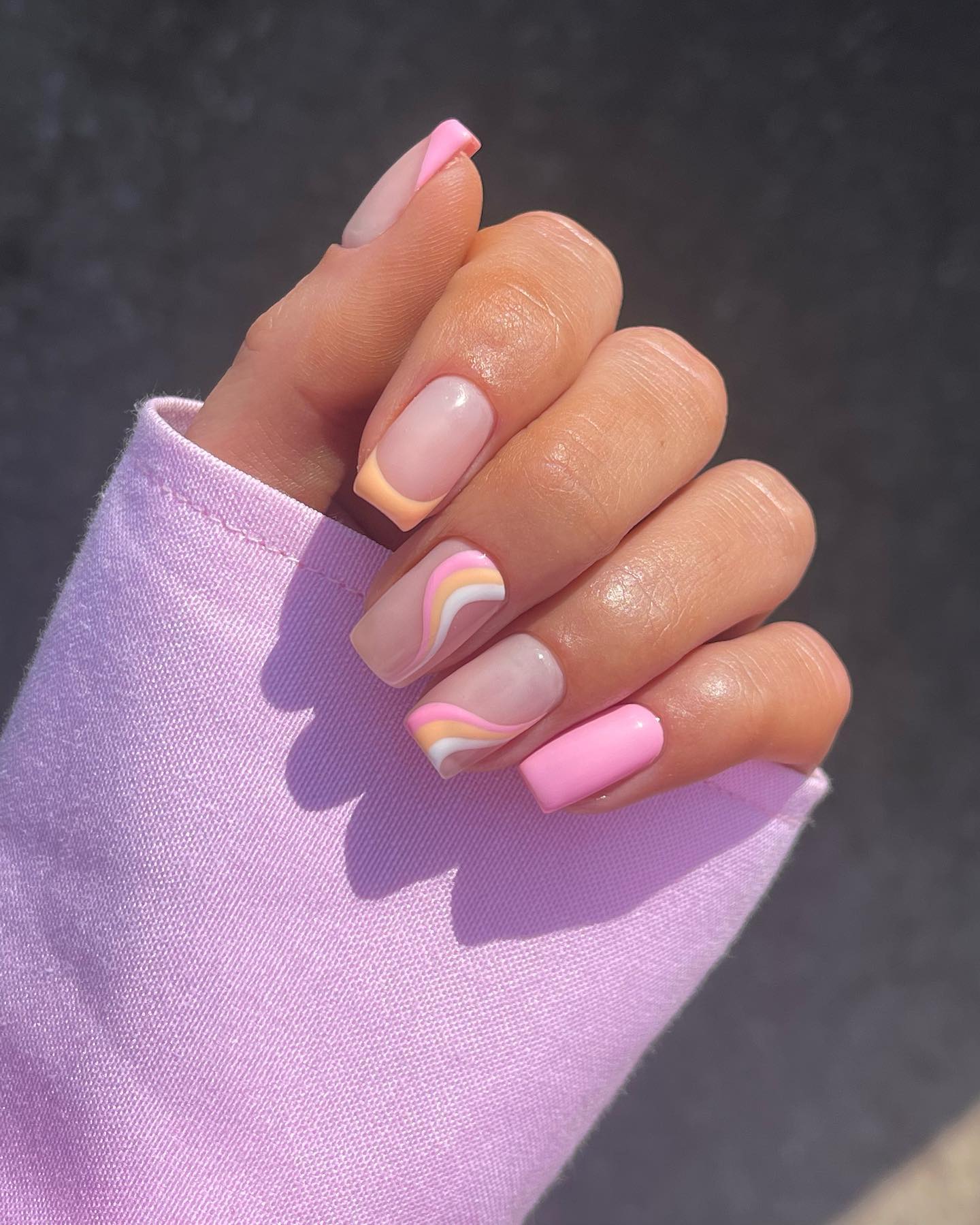 Pastel swirl nails with pink accents