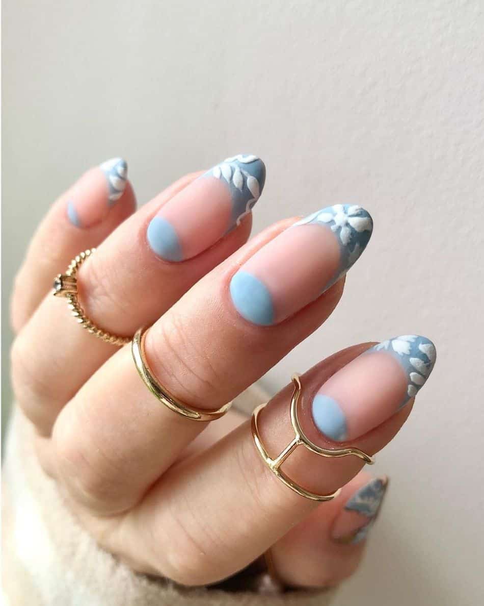 Blue lace French tips on almond nails