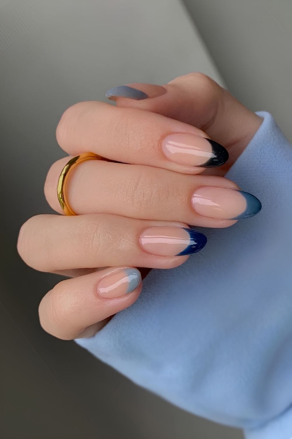Gradient blue French tips on almond nails