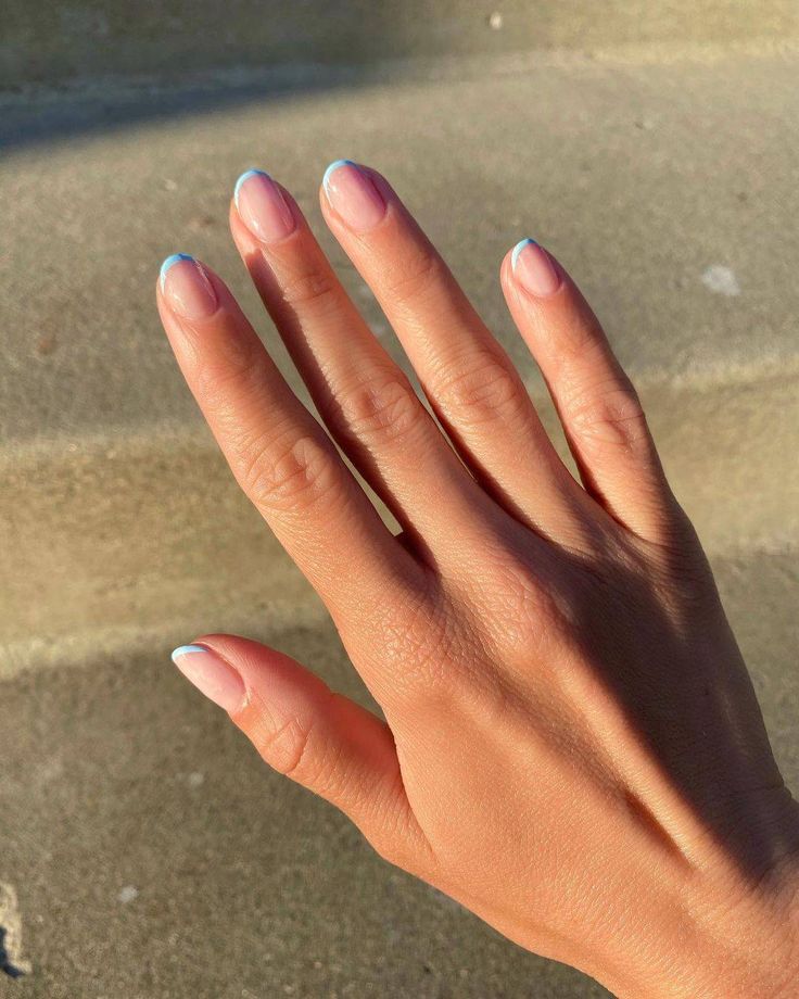 Pastel blue micro French tips on short nails