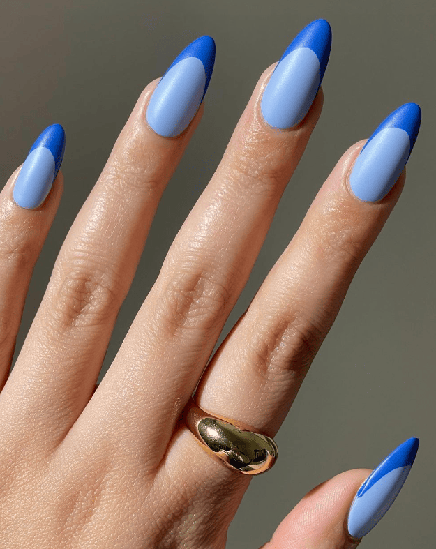 Graphic geometric blue nail art, bold and modern