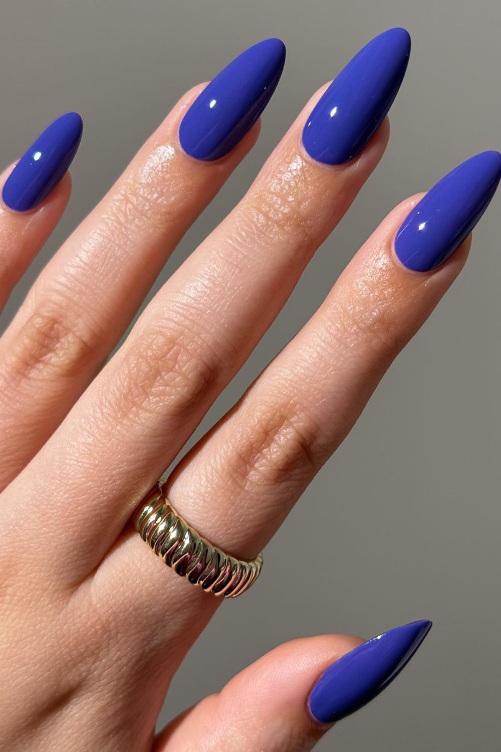 Glossy cobalt blue almond nails