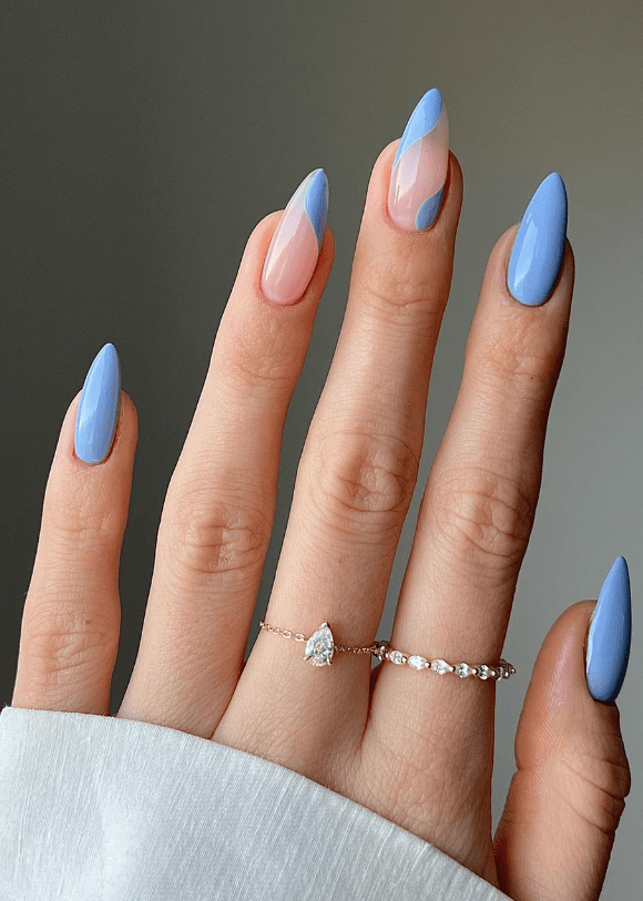 Sky blue and nude nails with geometric patterns