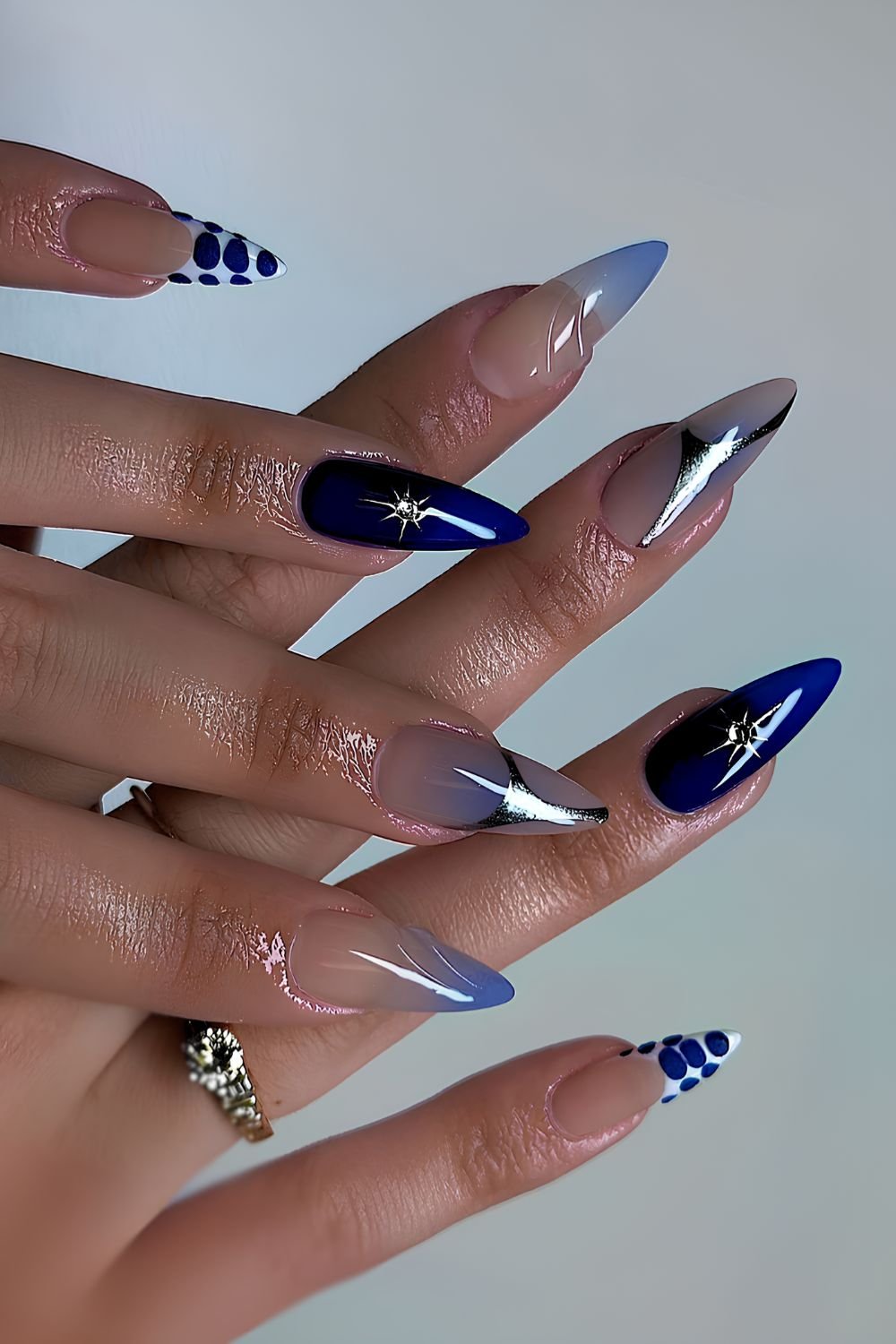 Galactic blue stiletto nails with silver accents