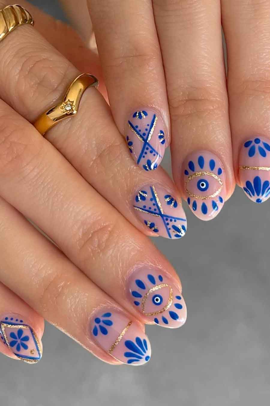 Bohemian blue nail art with geometric patterns
