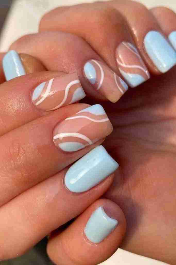 Abstract blue wave nail design with a modern twist