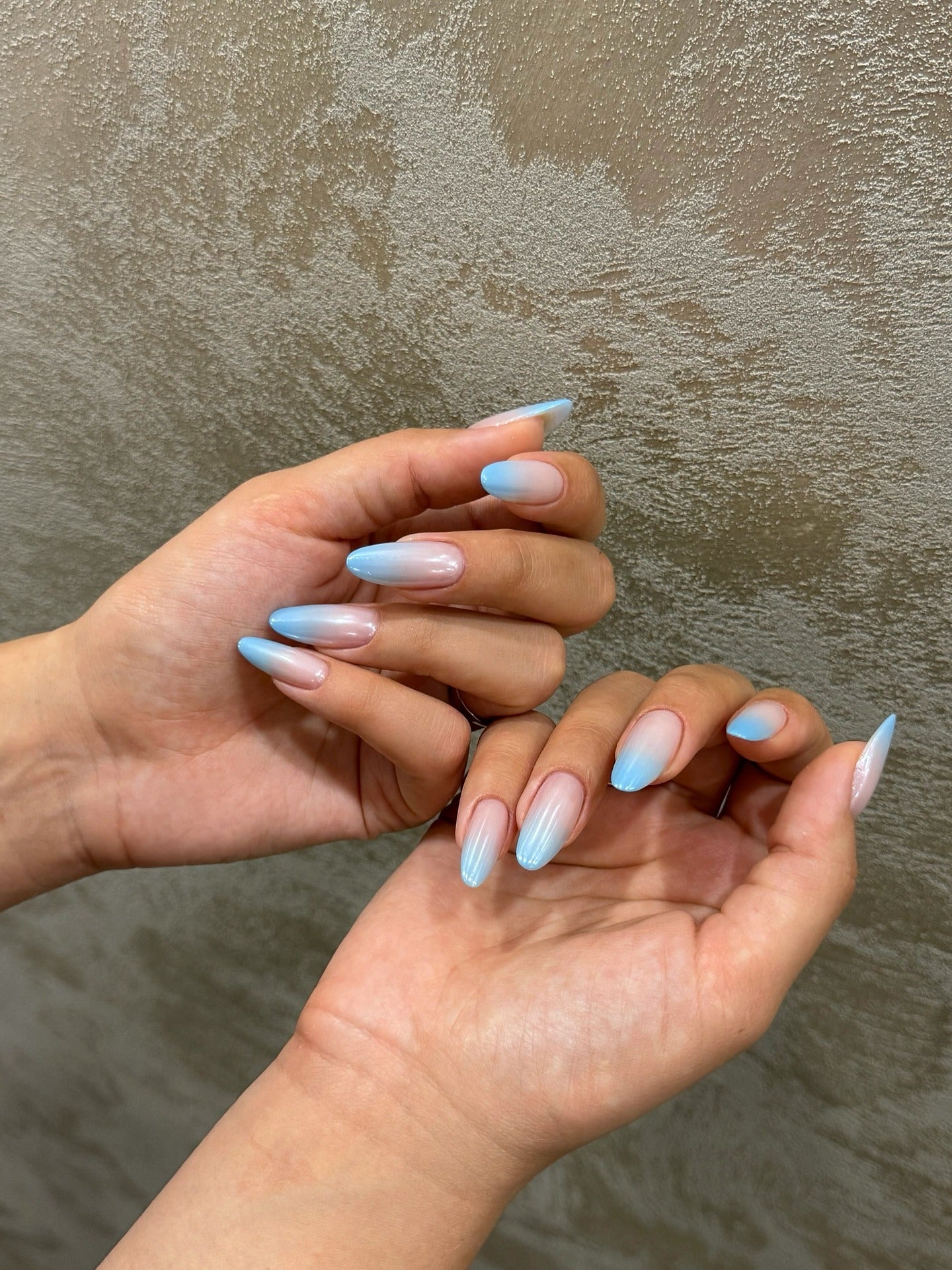 Gradient blue ombré nail design with smooth transition