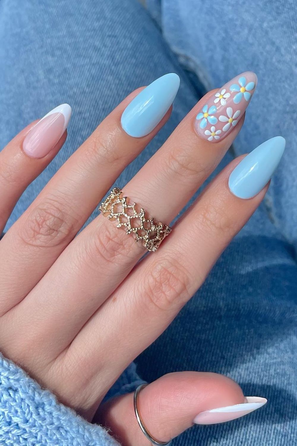Pastel blue blossom nail design with floral elegance
