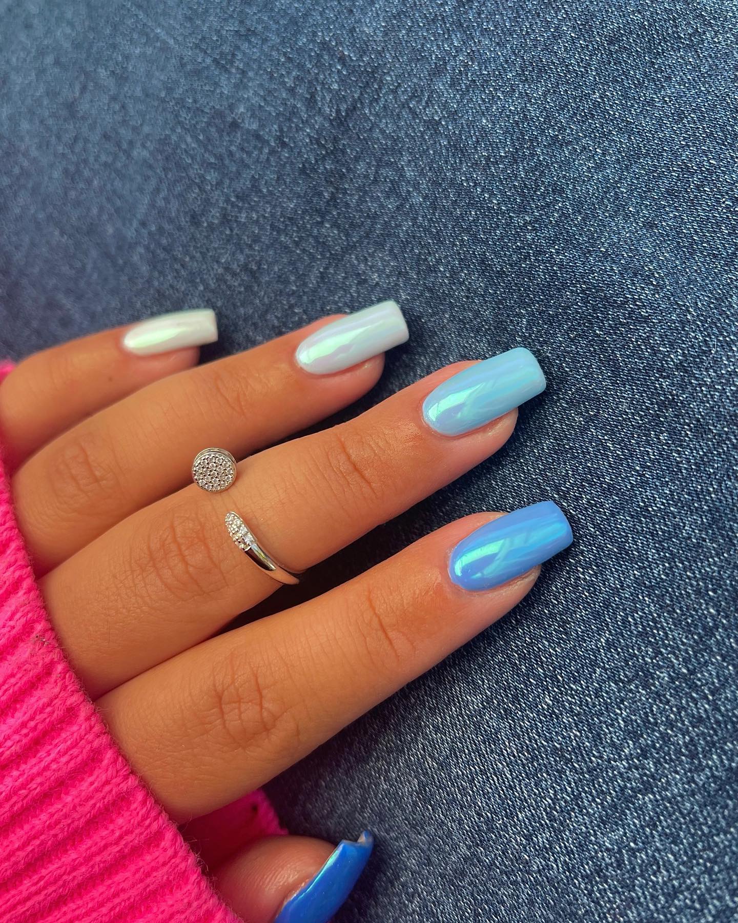 Ice blue and white nails with glossy finish on medium square nails