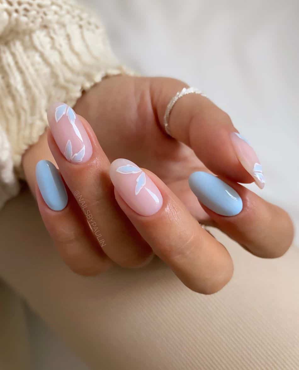 Soft blue petal nail art on medium almond nails