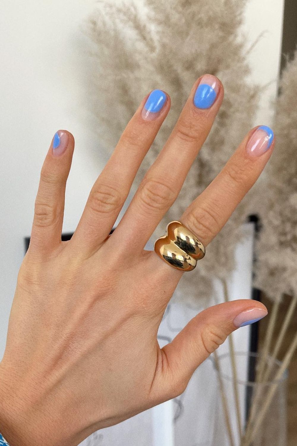 Minimalist blue French tips on short round nails