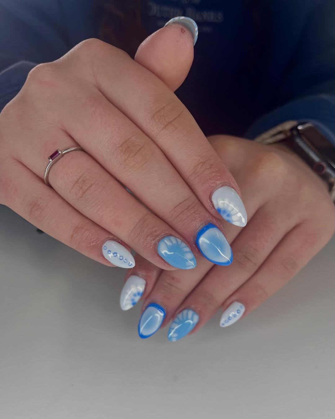 Blue and white contrast nails with artistic details