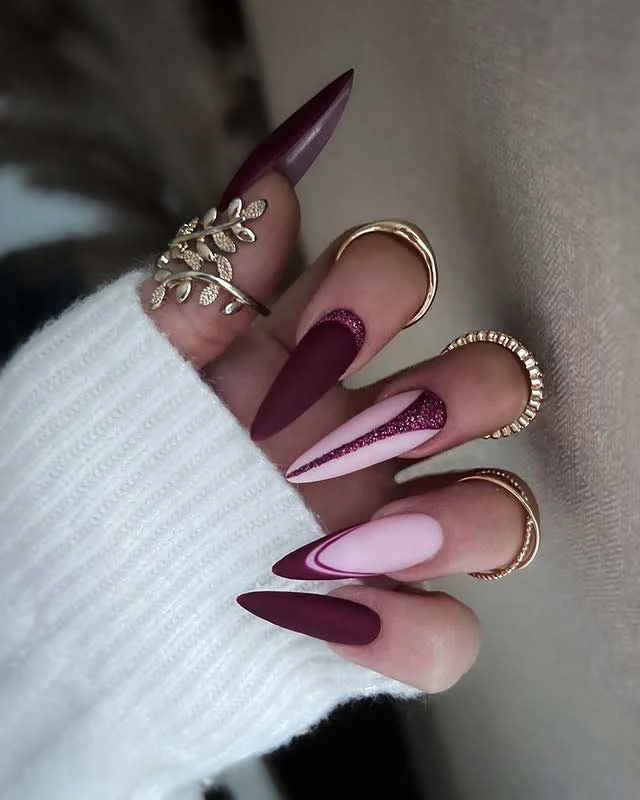Matte burgundy stiletto nails with pink accents