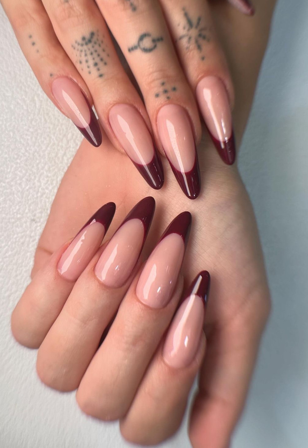 Burgundy French tip stiletto nails