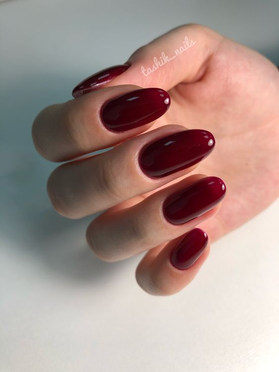 Glossy burgundy oval nails
