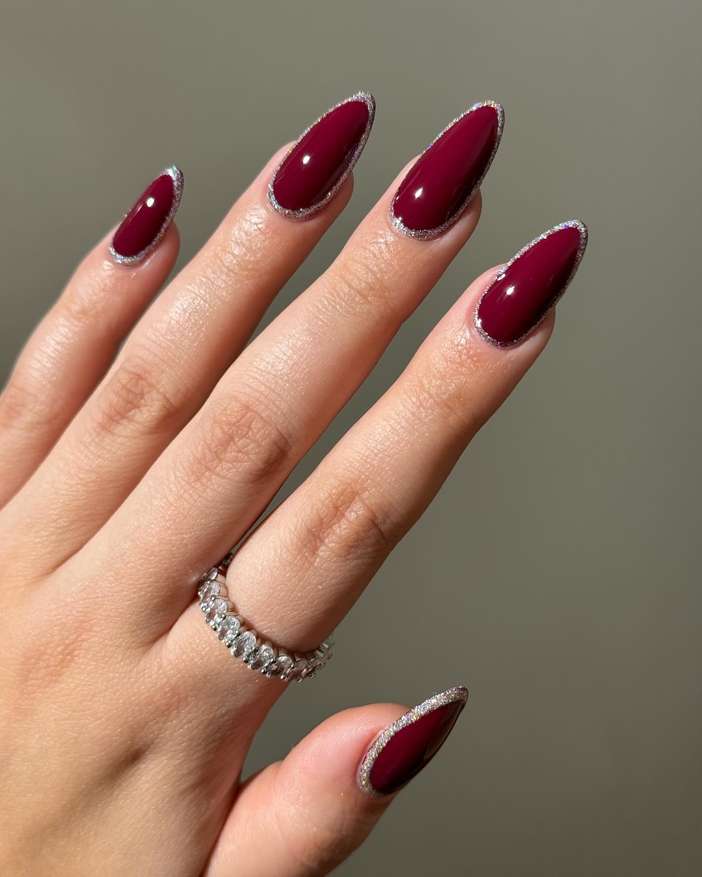 Burgundy stiletto nails with silver tips