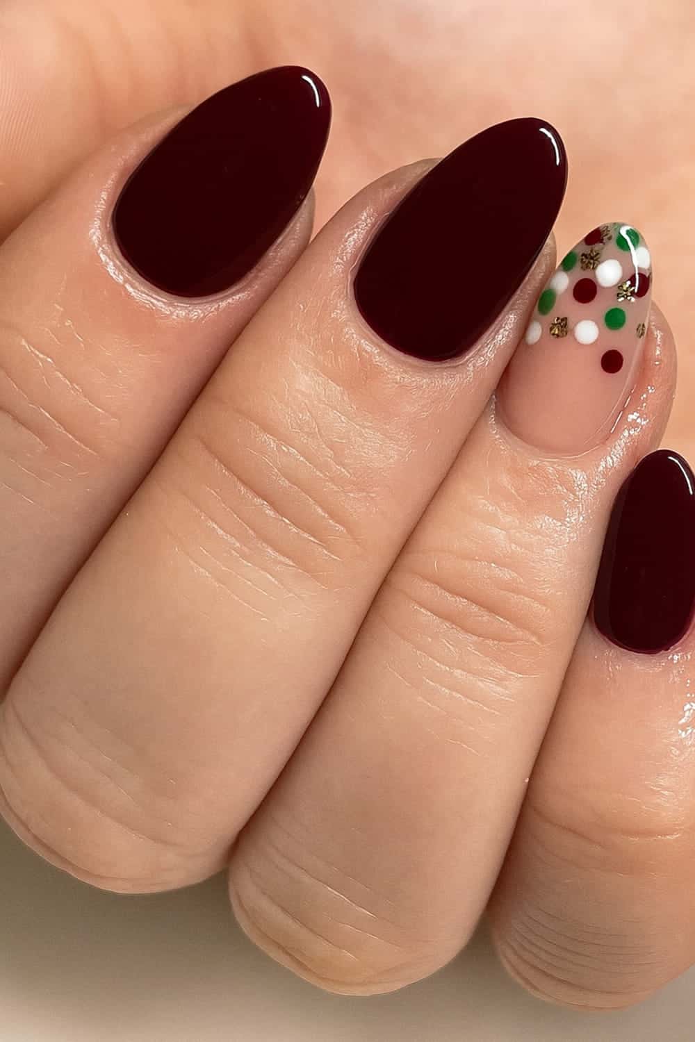 Cherry red nails with festive accents