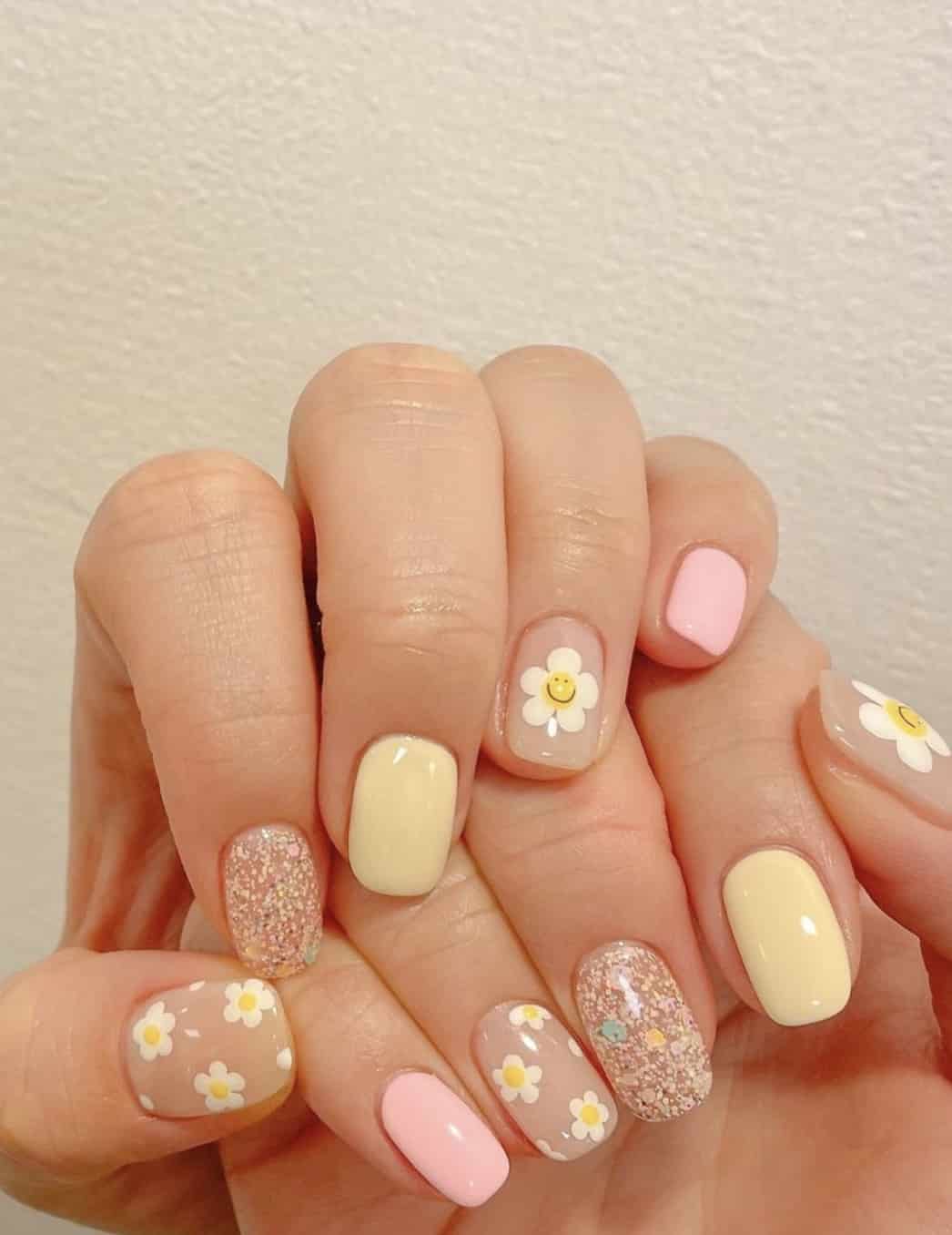 Pastel nails with daisy accents, Pinterest nail art, playful charm