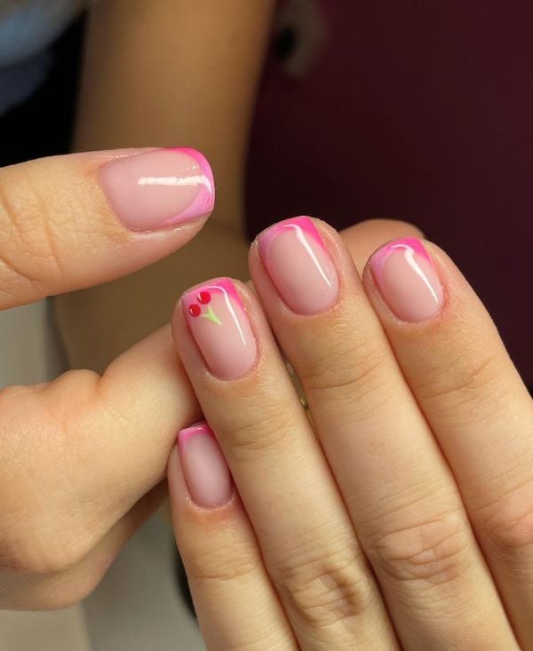 Hot pink French manicure on short nails.