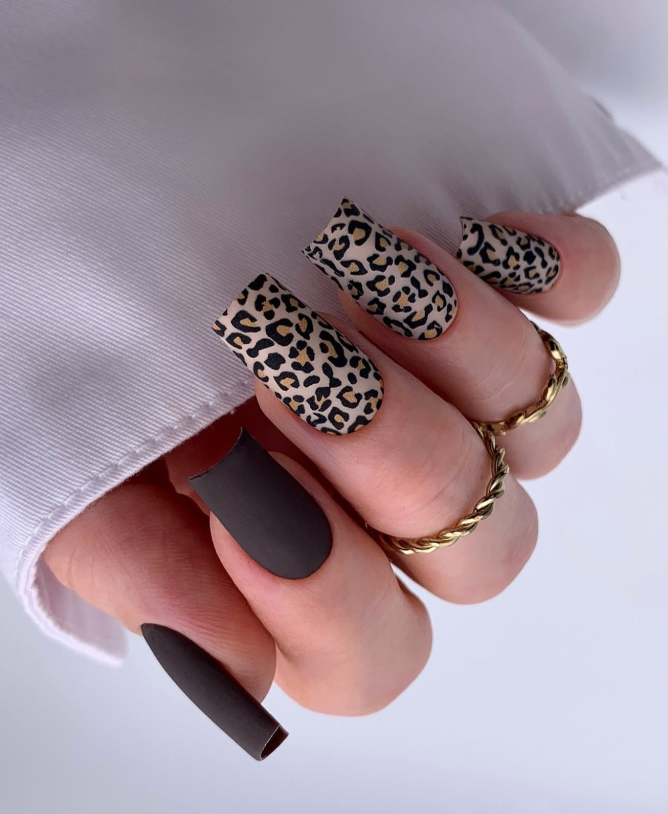 Matte leopard print and black nails.