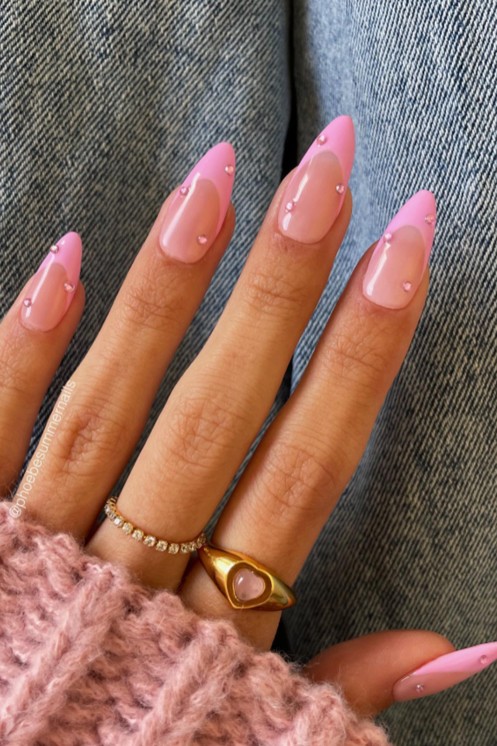 Pink French nails with rhinestones.